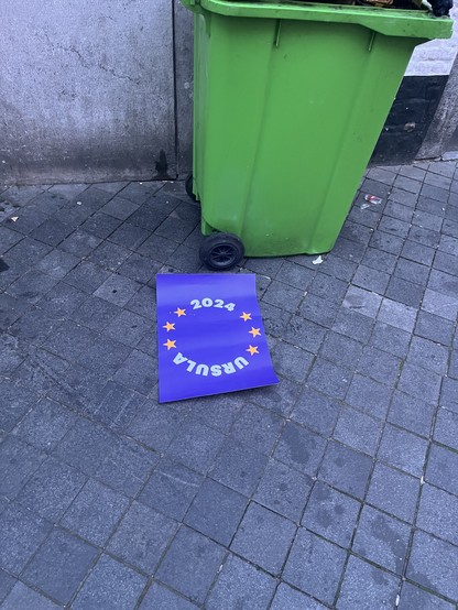 A sign reading 2024 Ursula next to a bin