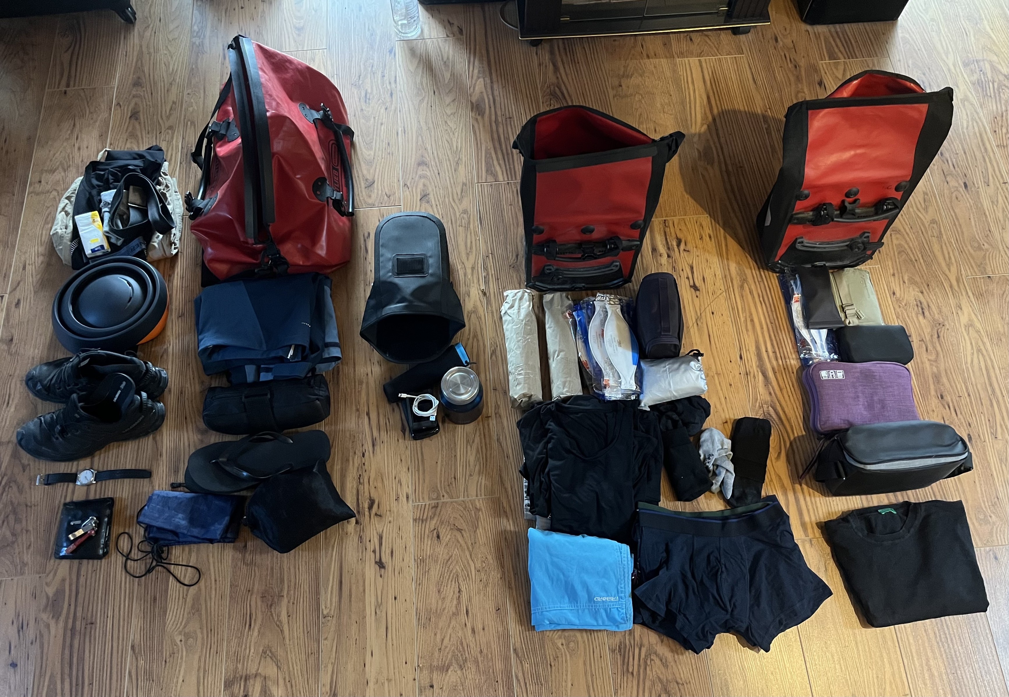 A load of things laid out to pack. Left is what I’ll wear. Then is a Ortlieb Rack pack that’ll contain waterproofs, the helmet and bike lock when not cycling. Then two Ortlieb panniers - one for clothes, one for tech and food.