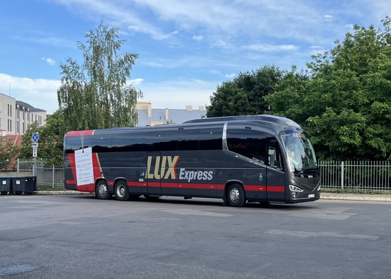 Lux Express coach at Vilnius. It’s grey and red. 