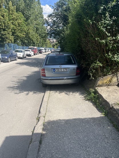 A car blocking a pavement