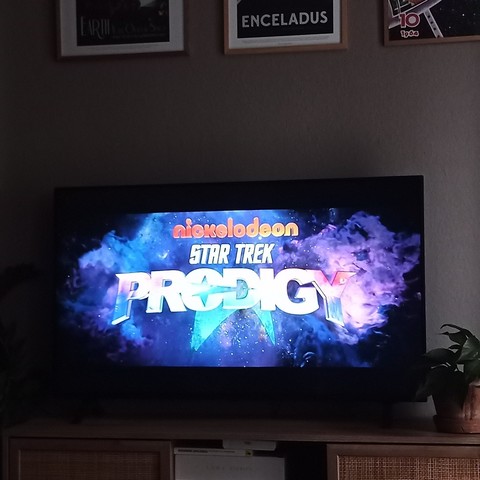 A TV with Star Trek Prodigy S2E1 running.