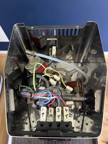 Assembled machine with lid removed showing cables 