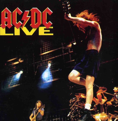 Albumcover. Oben links ist in roter Schrift das Logo von AC/DC, mit einem Blitz als Schrägstrich, darunter in gelben Buchstaben „live“. Das Cover zeigt ein von gelb-orangen Farben dominiertes Konzertfoto. Rechts im Vordergrund ist Lead-Gittarist Angus Young gerade bei einem Sprung in der Luft. Er trägt eine kurze blaue Hose weiße Socken und schwarze Schuhe, sein Oberkörper ist nackt. Am unteren Bildrand sind weitere Bandmitglieder zu sehen, im linken Bildbereich Gerüste von der Bühne und zwei blau leuchtende Scheinwerfer.